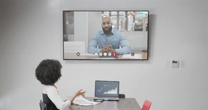 African american businesswoman on video call with african american male colleague on screen. Online connections, business and networking concept.