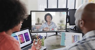 African american business people on video call with african american female colleague on screen. Online connections, business and networking concept.