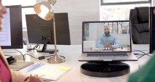 Laptop with video call with african american businessman on screen. Online connections, business and networking concept.