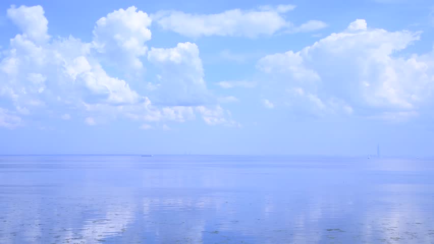 Beautiful day seascape. Surface of water covered with small waves. Blue sky with white clouds reflects in calm water. Abstract summer natural background. Real time video. Copy space. Vacation theme. | Shutterstock HD Video #1108361743