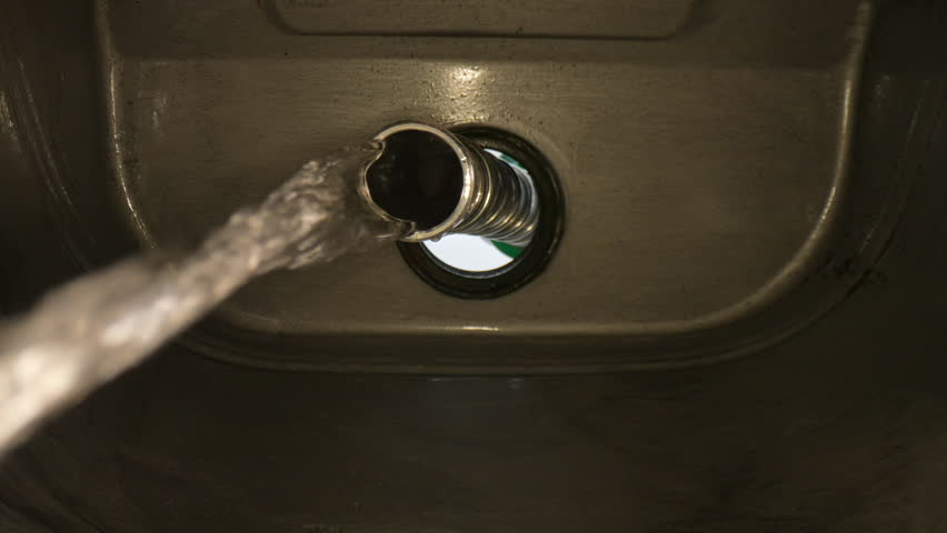 4K: Inside a fuel tank with the Nozzle filling the car up with Petrol, Gasoline or diesel. Internal view of gas pump. Clear. Stock Video Clip Footage