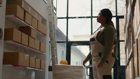 Manager in warehouse using AR holographic technology to visualize how to best stash parcels on shelves to make room for more. Supervisor in distribution center uses augmented reality - Powered by Shutterstock - Get 15% off with code: PIKWIZARD15