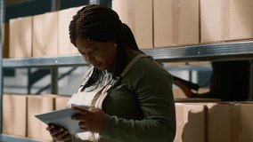 Portrait of african american warehouse director using to tablet to oversee parcels delivery, keeping track of storage room goods in fulfillment center ready to be sent to customers - Powered by Shutterstock - Get 15% off with code: PIKWIZARD15
