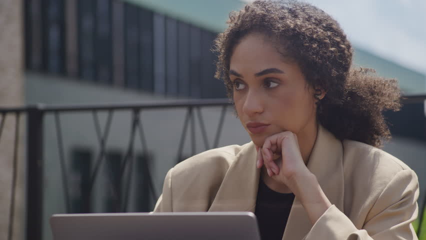 Pensive Woman Reading Bad News on Laptop Close Up Outdoors