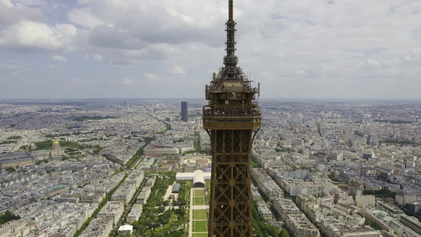 Aerial view of the observation deck at the top of the Eiffel Tower, 276 meters high, in Paris, France. Cinematic 4k.