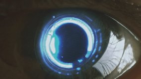 Large robotic android eye with a glowing cybernetic iris staring at the camera. Macro, close-up. Loop. Looping footage. Sci fi, science fiction cinematic video. Artificial intelligence concept. - Powered by Shutterstock - Get 15% off with code: PIKWIZARD15
