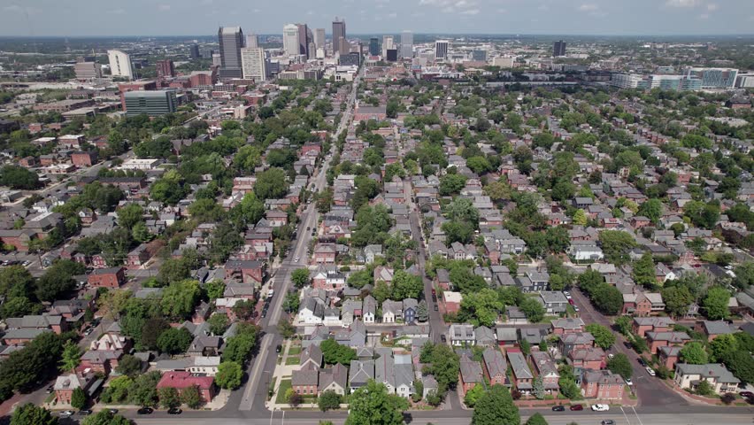 Columbus Ohio city and downtown skyline and towering buildings from aerial drone shot view looking north from German Village historic neighborhood and middle class suburb