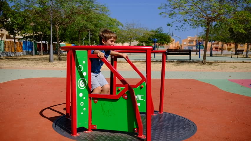 CHILD PLAYING IN THE PARK WALKING AROUND