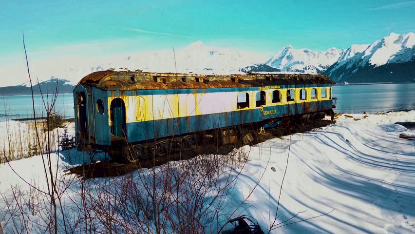 4K Drone Video of Abandoned Alaska Railroad Train Car on Seward, Alaska Beach on Snowy Winter Day