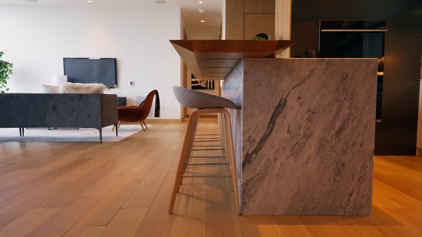Panning shot of modern kitchen bar with marble countertop Royalty-Free Stock Footage #1108383051
