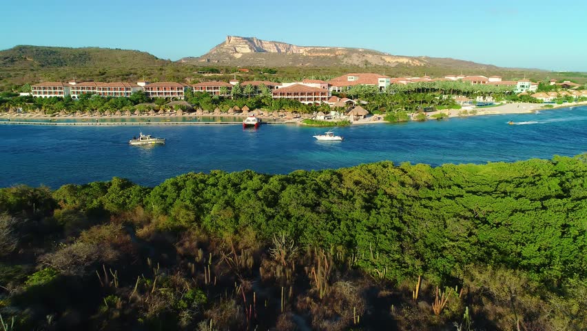 Coastguard Metal Shark vessel leaving bay inlet next to Santa Barbara, Sandals Resort in Curacao
