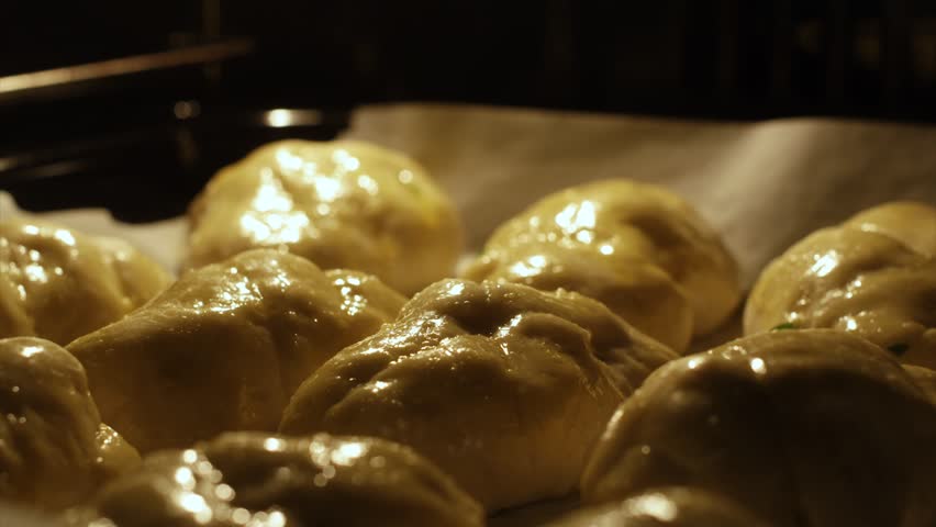 Baking Pastry in Oven. Close Up Shot of Dough and Cooking in Furnace. Timelapse Shot of Swelling Pastries in a Row.  | Shutterstock HD Video #1108387973