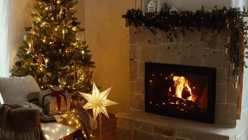 Atmospheric christmas eve at fireplace footage. Stylish christmas gifts, festive decorated tree with golden lights and cozy burning fireplace. Winter hygge Royalty-Free Stock Footage #1108406087