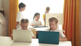 children learn from home through computers. business concept of modern training and development. group of little kids perform tasks in a lifestyle laptop at home schooling. educating at home