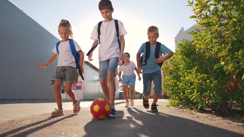 children near the school playing soccer. kids a school education kid dream concept. a group of children near the lifestyle school playing ball. a group of school children playing Royalty-Free Stock Footage #1108406123