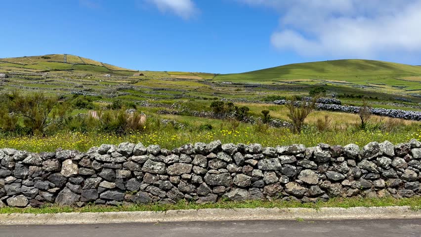 Stone wall Boundaries of Fields agriculture land with stones and boulders village lifestyle Europe