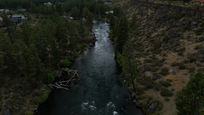 Aerial view Deschutes River Bend Oregon USA. Birds Eye View of Pacific Northwest river magic nature beautiful outdoor environmental forest trees foliage landscape background rapid spring summer dark 