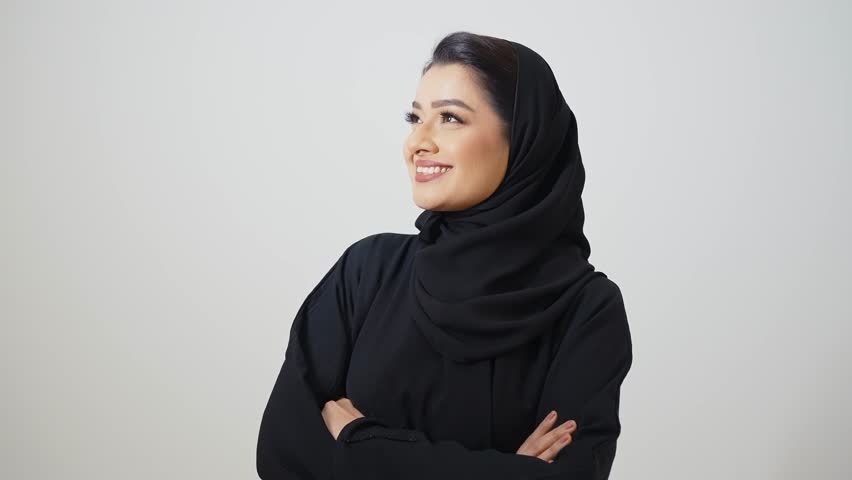 Beautiful arab middle-eastern woman with traditional abaya dress in studio - Arabic muslim adult female portrait in Dubai, United Arab Emirates Royalty-Free Stock Footage #1108417055