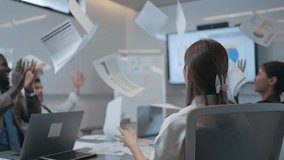 Team of business people throw papers and documents fly in air after meeting in boardroom. Successful teamwork throwing papers in the air. Success team concept - Powered by Shutterstock - Get 15% off with code: PIKWIZARD15