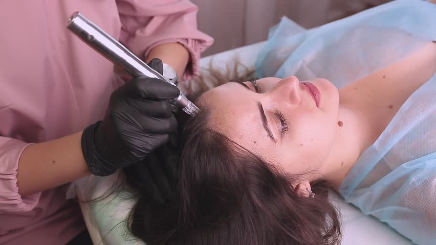 Treatment of the scalp for hair loss, alopecia. A trichologist doctor makes a dermapen procedure on the patient's head. Vitamin injections to improve hair growth. Royalty-Free Stock Footage #1108423219