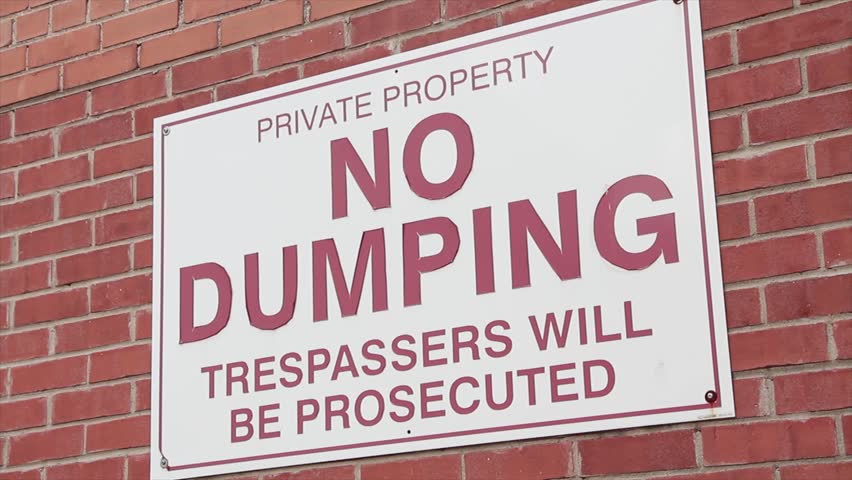 private property no dumping trespassers will be prosecuted horizontal rectangle sign on brick wall, red white, close up Royalty-Free Stock Footage #1108425125