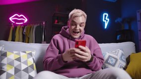 Surprised, joyful man uses phone. Man finds amazing ideas for his projects on social networks, explores new technologies and finds inspiration among community of like-minded people. Delight amazement - Powered by Shutterstock - Get 15% off with code: PIKWIZARD15