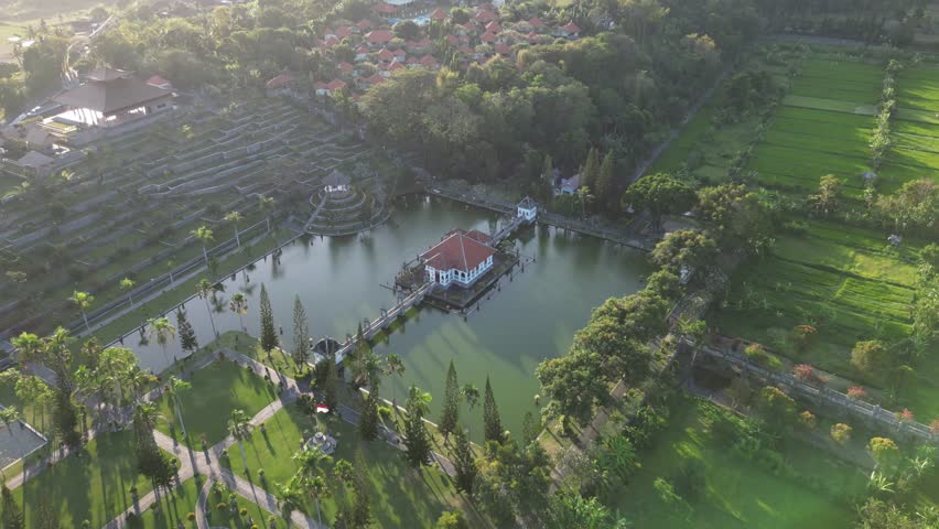 Beautiful ancient historic water palace surrounded by sea, water, ocean in the middle of rain forest with view from the sky