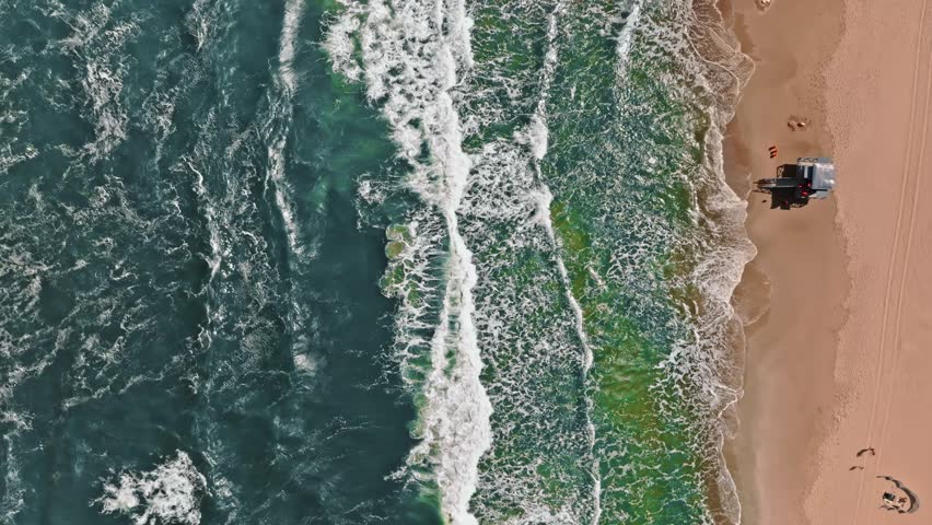 Lifeguard tower flooded by Baltic Sea with big waves, Poland. Aerial view of Baltic sea after storm. Royalty-Free Stock Footage #1108450467