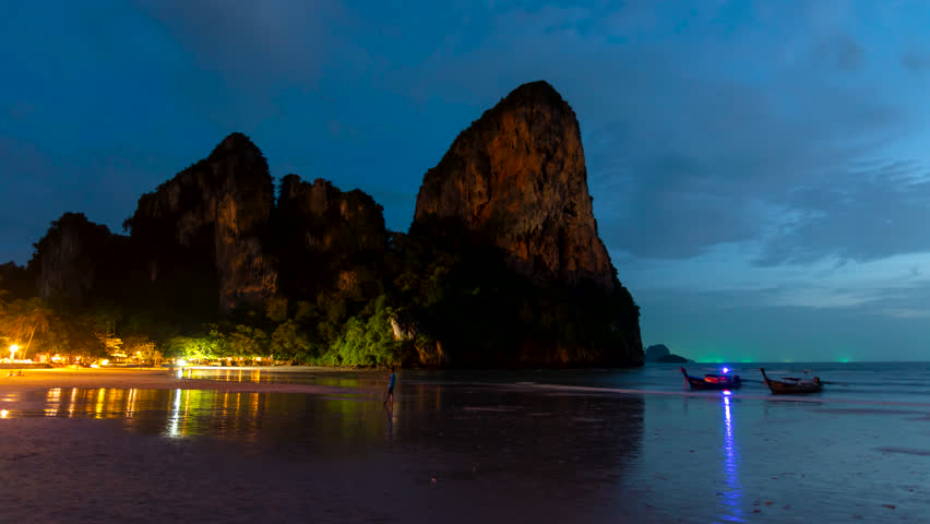 Timelapse of waves, clouds, tourist, boats at night, at Railay beach, Krabi, Thailand Royalty-Free Stock Footage #1108452469