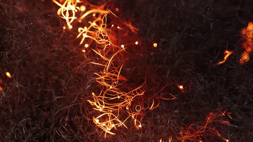 Macro shot of steel wool burning. Great for a background.
