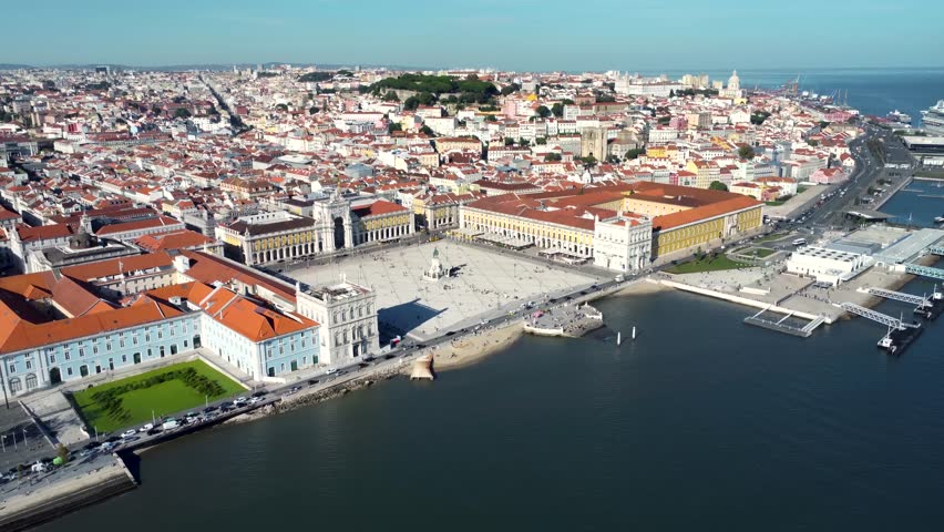 Cinematic aerial view of Lisbon city - Portugal. View of "Praça do Comércio" - Commerce Square in the city center. In front of the square is the river Tagus with promenade area and port. Drone forward Royalty-Free Stock Footage #1108461125