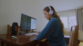young latin woman working at home on the computer