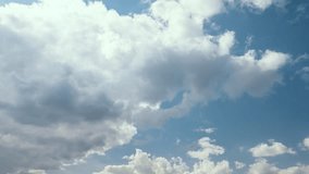 Clouds forming time lapse. White clouds in blue sky. 4k footage UHD 3840x2160 
