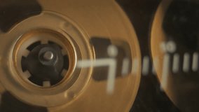 Cassette tape player rolling, macro shot. A retro music seamless loop B-roll video, with a natural color aesthetic