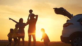 family by car resting in the park. family and children silhouette resting on the car playing ball at sunset in park on vacation. happy family kid dream concept sun. camping by car in the park - Powered by Shutterstock - Get 15% off with code: PIKWIZARD15