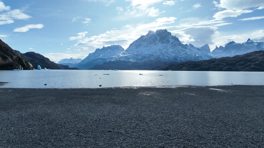 Grey Lake At Torres Del Paine In Antartica Chile. Snowy Mountains. Lake Landscape. Grey Lake At Torres Del Paine In Antartica Chile. Antartica Chile. Winter Background. Grey Lake At Torres Del Paine. Royalty-Free Stock Footage #1108478147