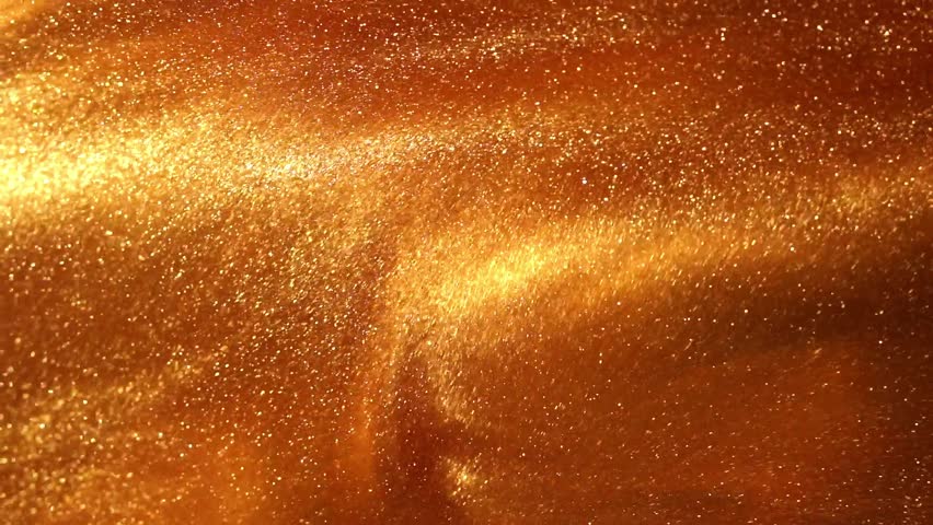 Gold liquid with tints of golden glitters. Yellow background with a scattering of gold sparkles. Magic Galaxy of golden dust particles in fluid.  Royalty-Free Stock Footage #1108479599