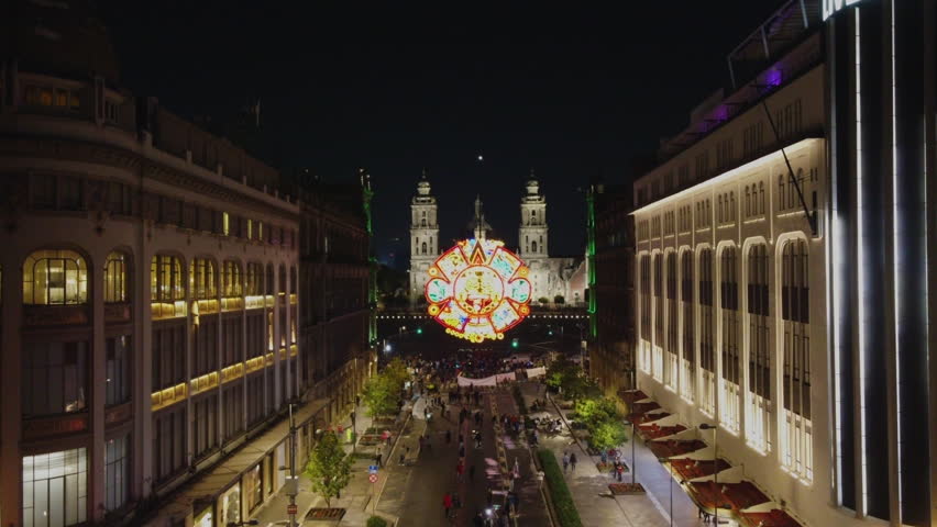 Aztec calendar led sign in the mexico zocalo street, downtown drone view. Celebrating the Mexican Independence Day and the 5 mayo. Royalty-Free Stock Footage #1108484711