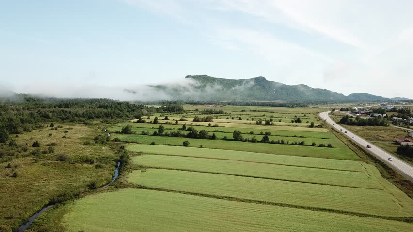 Clouds overflowing a mountain on ridge of st-laurence river in Gaspesie Quebec Canada