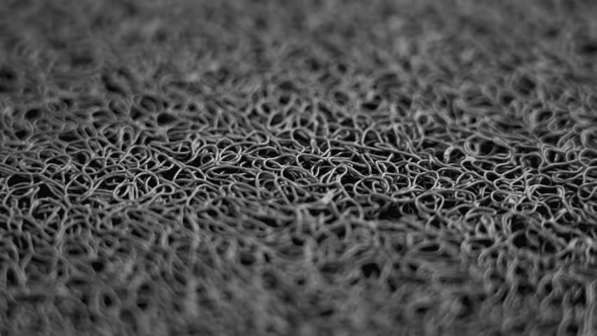 Rubber fibrous texture door mat with porous tangled texture. Macro. Rotation | Shutterstock HD Video #1108486123