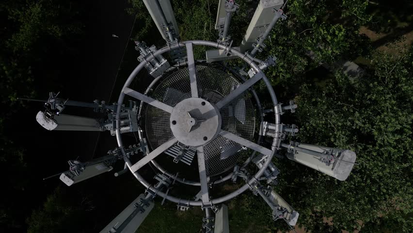 transmission of various drum shapes on a telecommunications tower. colors white and khaki green cones. transfer of phone signal and 5g, 4g internet. multiple TV antenna amplifier