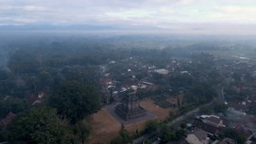 Aerial view of stone monument of Mendut Temple. Ancient Buddhist Temple in Magelang, Indonesia - 4K drone shot