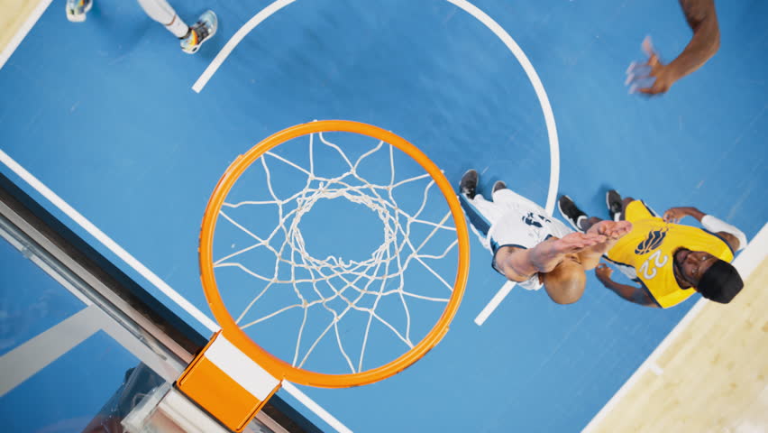 Basketball Action in a Slow Motion Replay for Sports News: Yellow Team Scores a Successful Goal, Performs a Fast Slam Dunk with One Hand. Top Down Footage From a Camera Hovering Above the Basket Royalty-Free Stock Footage #1108499905