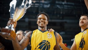 Happy Diverse Sports Team Victorious at Basketball Association Playoffs: Group of Players Celebrate the Victory Together with a Coach. Close Up Portrait on Live Sports Broadcast Television Channel - Powered by Shutterstock - Get 15% off with code: PIKWIZARD15