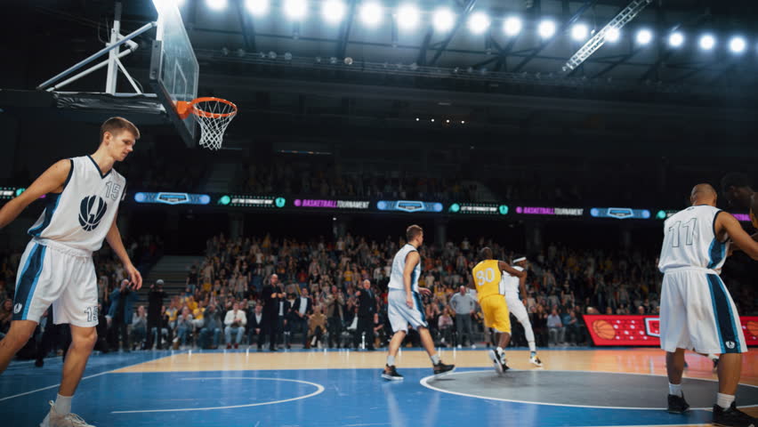 Cinematic Replay of Basketball Action for Live TV Channel Playback: African Yellow Team Player Catches the Pass and Scores a Powerful Slam Dunk Goal and Hangs on the Hoop to Entertain the Fans | Shutterstock HD Video #1108499961