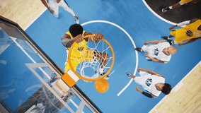 Slow Motion Cinematic Replay of Basketball Action for Live TV Channel Playback: Top Down Zoom Out Footage of an African Yellow Team Player Scores a Powerful Slam Dunk Goal and Hangs on the Hoop - Powered by Shutterstock - Get 15% off with code: PIKWIZARD15