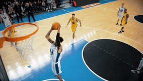 Basketball Tournament Match: White Team Player Passing the Ball to a Skillful Teammate, Multiethnic Sportsman Pass Defense and Slam Dunks the Ball. High Angle Sports Action TV Replay in Slow Motion - Powered by Shutterstock - Get 15% off with code: PIKWIZARD15