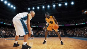 Slow Motion Replay of a Basketball Match in an Arena. Stylish Player Dribbling with the Ball, Running to Score an Impressive Two-Point Goal with a Slam Dunk. Cinematic Sports Channel Footage - Powered by Shutterstock - Get 15% off with code: PIKWIZARD15