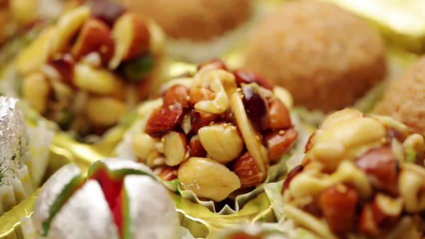 Close-up of different types of Indian sweets, for Diwali festival. Khoa Ladoo, Dryfruits Ladoo.