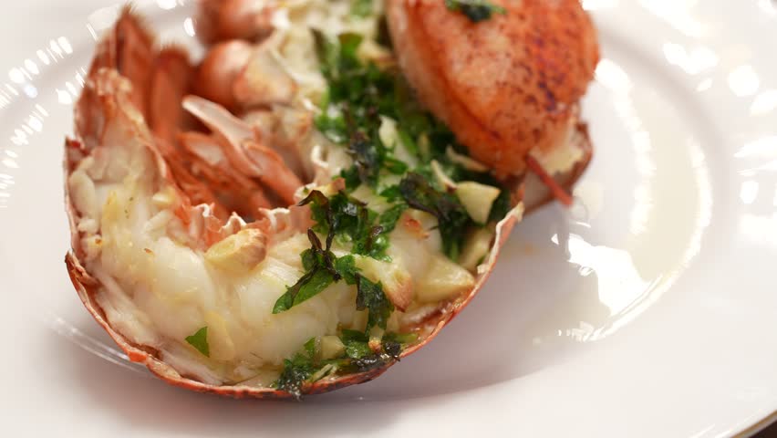 Delicious Cooked Lobster spinning on a plate